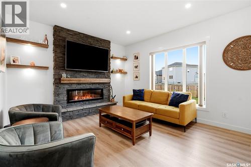 302 Chelsom Manor, Saskatoon, SK - Indoor Photo Showing Living Room With Fireplace
