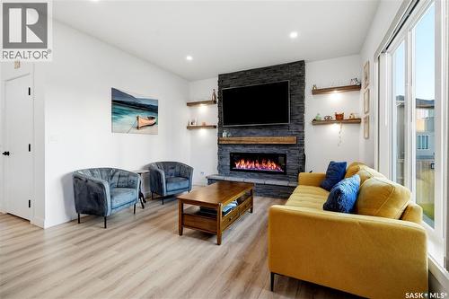 302 Chelsom Manor, Saskatoon, SK - Indoor Photo Showing Living Room With Fireplace