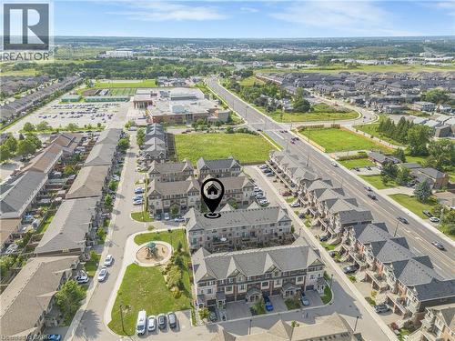 Townhome community with a modern architectural style and dark shingled roofs - 1890 Rymal Road E Unit# 144, Hamilton, ON - Outdoor With View