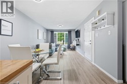 Recessed lighting, wood-finish flooring, and a built-in wall shelf with hooks - 