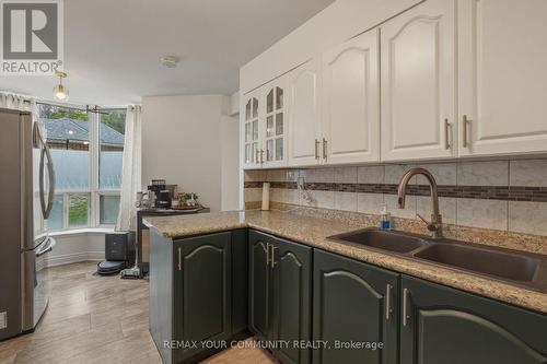 103 - 410 Mclevin Avenue, Toronto, ON - Indoor Photo Showing Kitchen With Double Sink