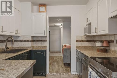 103 - 410 Mclevin Avenue, Toronto, ON - Indoor Photo Showing Kitchen With Double Sink