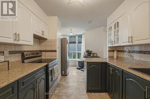 103 - 410 Mclevin Avenue, Toronto, ON - Indoor Photo Showing Kitchen