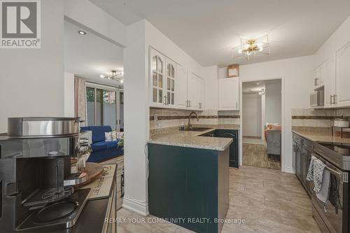 103 - 410 Mclevin Avenue, Toronto, ON - Indoor Photo Showing Kitchen