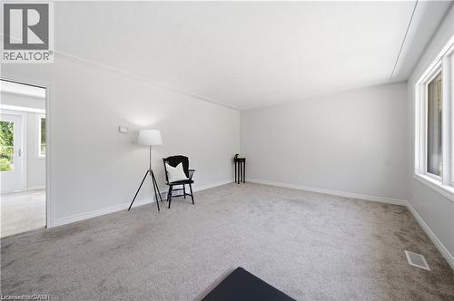 Light gray carpeting with white trim, white walls, and a white ceiling - 64 Warren Road, Kitchener, ON - Indoor Photo Showing Other Room