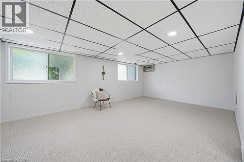 Recessed lighting, drop ceiling, and light-colored carpet flooring - 64 Warren Road, Kitchener, ON - Indoor Photo Showing Other Room