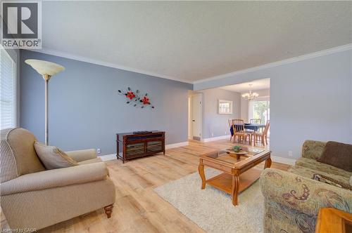 Recessed lighting, crown molding, light wood-finish flooring, and an open entryway to the dining area - 251 Union Street E, Waterloo, ON - Indoor Photo Showing Living Room