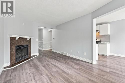 1 Perthshire Court, Hamilton, ON - Indoor Photo Showing Living Room With Fireplace