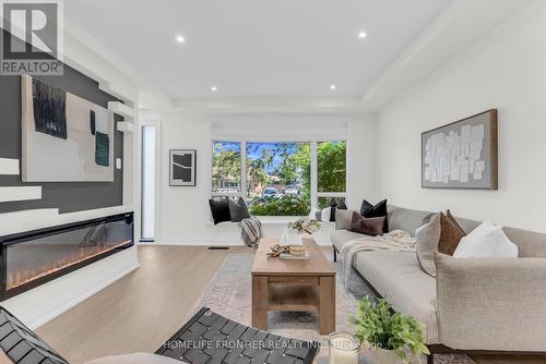 61 Sundial Crescent, Toronto, ON - Indoor Photo Showing Living Room With Fireplace