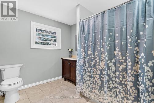 Neutral-toned tile flooring, a white window frame - 312 Old Guelph Road, Hamilton, ON 
