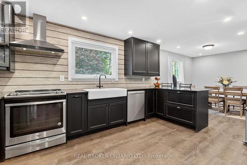 Modern kitchen featuring dark wood-finish cabinets - 312 Old Guelph Road, Hamilton, ON 