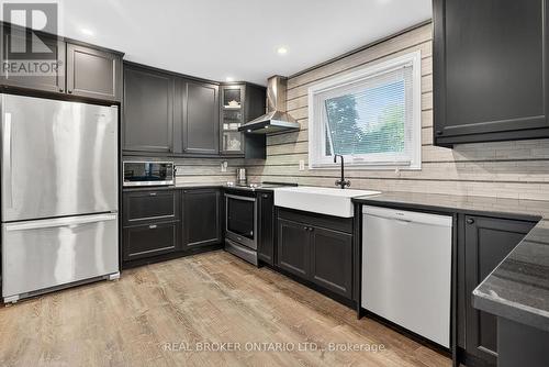 farmhouse sink with a gooseneck faucet - 312 Old Guelph Road, Hamilton, ON 