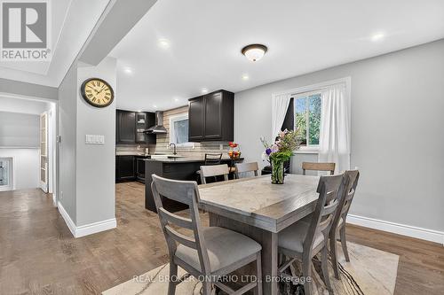 Open-concept dining area with wood-finish flooring - 312 Old Guelph Road, Hamilton, ON 