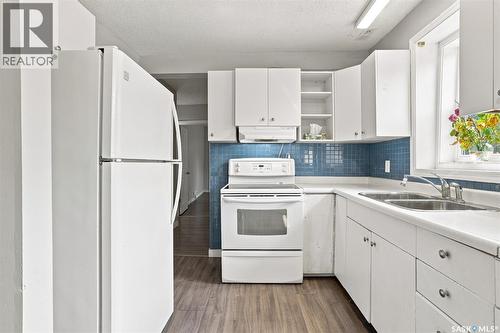 1539 B Avenue N, Saskatoon, SK - Indoor Photo Showing Kitchen With Double Sink