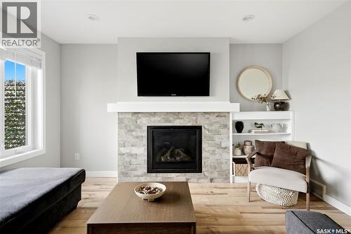 5565 Norseman Crescent, Regina, SK - Indoor Photo Showing Living Room With Fireplace
