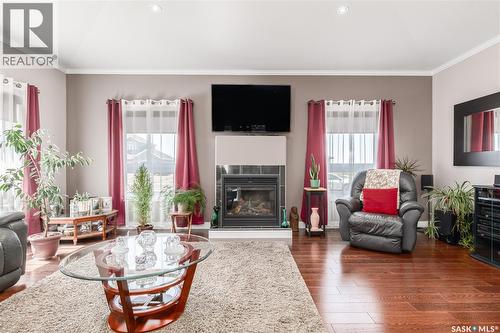 111 Iron Bridge Drive, Moose Jaw, SK - Indoor Photo Showing Living Room With Fireplace