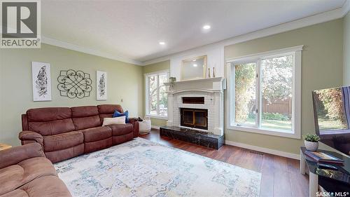 2210 Hanover Crescent E, Regina, SK - Indoor Photo Showing Living Room With Fireplace