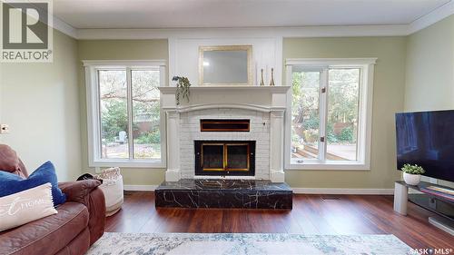 2210 Hanover Crescent E, Regina, SK - Indoor Photo Showing Living Room With Fireplace
