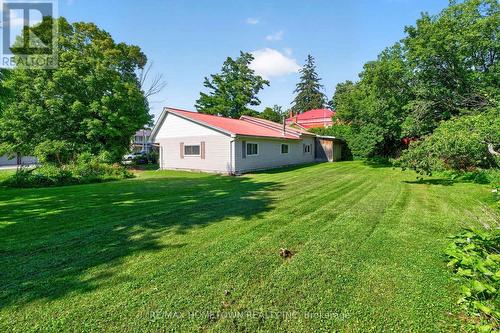 Back yard behind the garage - 116 Mill Creek Drive, Rideau Lakes, ON 