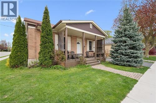 Brick exterior with a covered front porch and a paved walkway - 27 Roseview Avenue, Cambridge, ON - Outdoor With Deck Patio Veranda