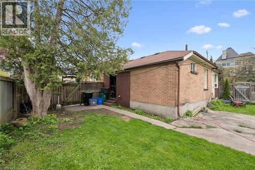 Brick exterior with a brown roof and concrete foundation - 27 Roseview Avenue, Cambridge, ON - Outdoor