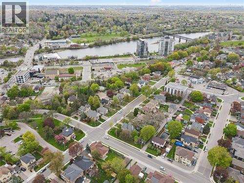 Aerial perspective showcasing a developed neighborhood with mature trees, established residential properties, and paved streets - 27 Roseview Avenue, Cambridge, ON - Outdoor With View