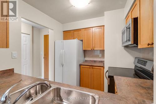 201 - 99 Hayden Street, Toronto, ON - Indoor Photo Showing Kitchen With Double Sink