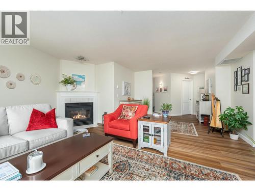 3301 Centennial Drive Unit# 309, Vernon, BC - Indoor Photo Showing Living Room With Fireplace