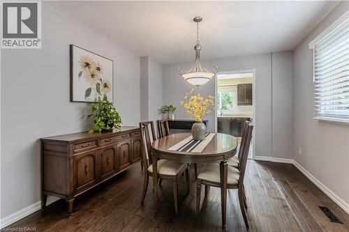 Hardwood-finish flooring, light grey wall paint, and white trim - 1238 Sable Drive, Burlington, ON - Indoor Photo Showing Dining Room