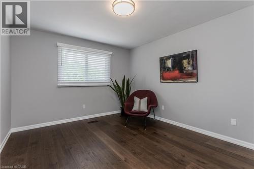 Wood-finish flooring, white trim, and a ceiling-mounted light fixture - 1238 Sable Drive, Burlington, ON - Indoor Photo Showing Other Room
