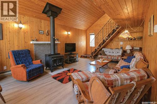 303 Christel Crescent, Lac Des Îles, SK - Indoor Photo Showing Other Room With Fireplace