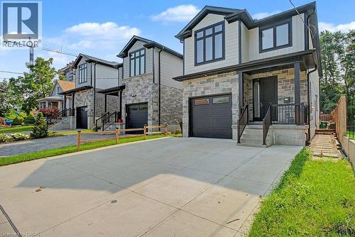 Modern exterior featuring stone and siding finishes - 31 Fourth Avenue, Kitchener, ON - Outdoor With Facade