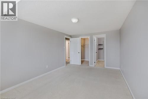 Neutral-toned walls and light-colored carpeting - 248 Bridlewreath Street, Kitchener, ON - Indoor Photo Showing Other Room
