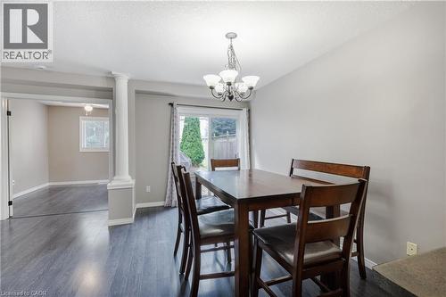 Wood-finish flooring throughout, recessed lighting, and a column accent - 248 Bridlewreath Street, Kitchener, ON - Indoor Photo Showing Dining Room