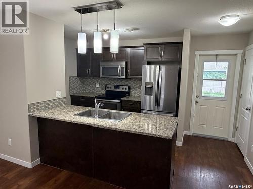 604 3440 Avonhurst Drive, Regina, SK - Indoor Photo Showing Kitchen With Double Sink With Upgraded Kitchen
