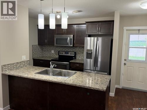 604 3440 Avonhurst Drive, Regina, SK - Indoor Photo Showing Kitchen With Double Sink With Upgraded Kitchen