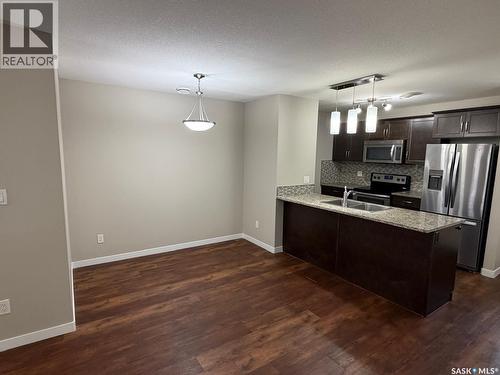 604 3440 Avonhurst Drive, Regina, SK - Indoor Photo Showing Kitchen With Double Sink