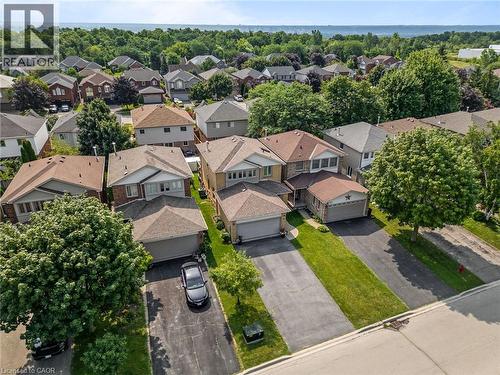 Residential neighborhood with mature trees - 57 Grindstone Way, Waterdown, ON - Outdoor With Facade