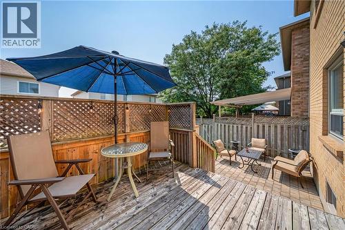 Wooden deck with lattice privacy fencing and a brick exterior - 57 Grindstone Way, Waterdown, ON - Outdoor With Deck Patio Veranda With Exterior