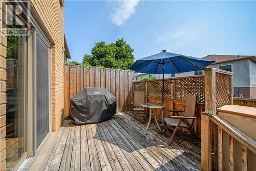 Expansive wood-finish deck with privacy fencing and lattice panels - 57 Grindstone Way, Waterdown, ON - Outdoor With Deck Patio Veranda With Exterior