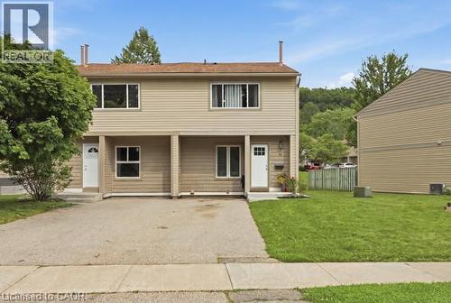 Duplex exterior with light-colored siding and white trim - 15 Green Valley Drive Unit# 41, Kitchener, ON - Outdoor
