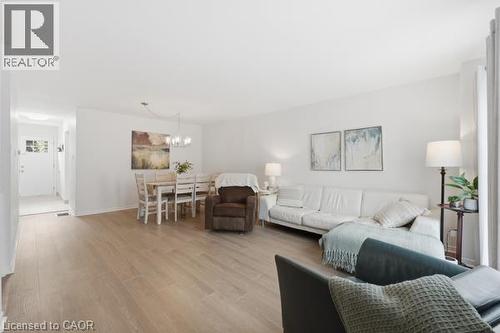 Spacious open-concept layout with light wood-finish flooring - 15 Green Valley Drive Unit# 41, Kitchener, ON - Indoor