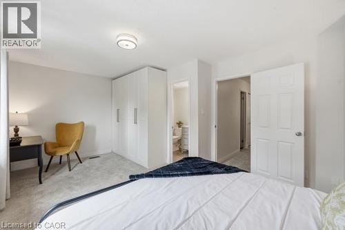 Neutral-toned walls complement a carpeted floor - 15 Green Valley Drive Unit# 41, Kitchener, ON - Indoor Photo Showing Bedroom