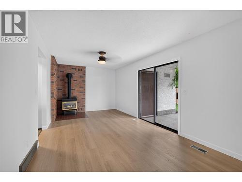 Dining room/Family room - 1494/1496 Elm Street, Kelowna, BC - Indoor With Fireplace