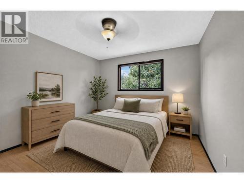 Primary bedroom *virtually staged* - 1494/1496 Elm Street, Kelowna, BC - Indoor Photo Showing Bedroom
