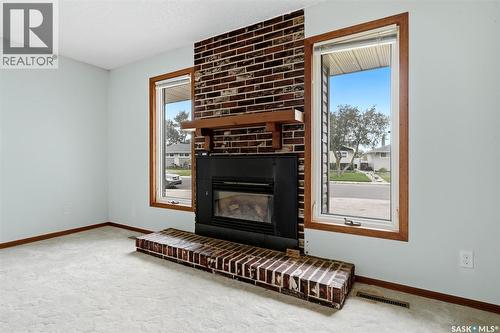 65 Mccaul Crescent, Regina, SK - Indoor Photo Showing Living Room With Fireplace