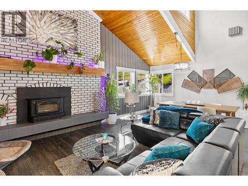 Living Room to dining area - 3341 Broadview Road, West Kelowna, BC - Indoor Photo Showing Living Room With Fireplace