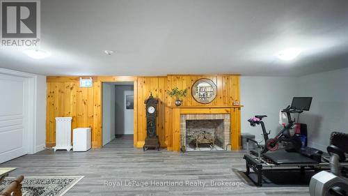 100 - 5 Cobourg Street, Goderich (Goderich (Town)), ON - Indoor Photo Showing Other Room With Fireplace