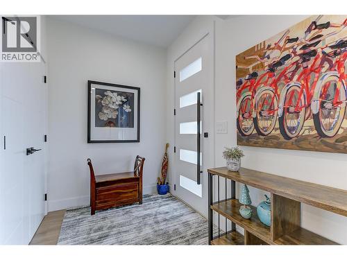 Welcoming front foyer with a dedicated coat closet — practical storage right where you need it - 747 Patterson Avenue Unit# 2, Kelowna, BC - Indoor Photo Showing Other Room