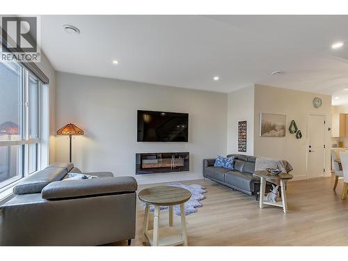 Bright open-concept living • electric fireplace - 747 Patterson Avenue Unit# 2, Kelowna, BC - Indoor Photo Showing Living Room With Fireplace